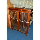 A MAHOGANY GLAZED TWO DOOR CHINA CABINET, a mahogany swing mirror and five various table lamps