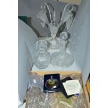 TWO GLASS DECANTERS AND STOPPERS, a clear glass epergne, central vase and one trumpet damaged and