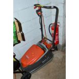 A FLYMO TURBO COMPACT 300 ELECTRIC LAWN MOWER (Spares and Repairs) together with a workmate and a