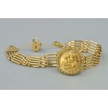 A 9CT GOLD HALF SOVEREIGN FIVE BAR GATE BRACELET, centering on an Elizabeth II half sovereign