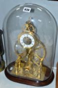 A 20TH CENTURY BRASS SKELETON CLOCK, under a glass dome, made by the vendors grandfather, height