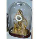 A 20TH CENTURY BRASS SKELETON CLOCK, under a glass dome, made by the vendors grandfather, height