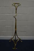 A LATE 19TH CENTURY ART NOUVEAU BRASS STAND, the circular top on a twisted upright and a shaped