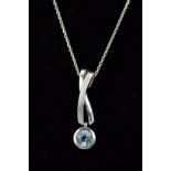 A MODERN 9CT WHITE GOLD BLUE TOPAZ SINGLE STONE DROP PENDANT, cross over design polished and satin