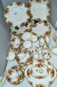 A SMALL QUANTITY OF ROYAL ALBERT 'OLD COUNTRY ROSES' SIX PLACE TEA/DINNER WARES, to include cups,