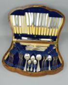 AN EARLY 20TH CENTURY OAK CASED CANTEEN, containing and incomplete set of silver plated Old