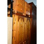 A MODERN PINE TWO DOOR WARDROBE, and a pair of pine three drawer bedside cabinets (3)