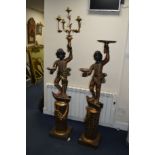 TWO 20TH CENTURY PAINTED CARVED WOOD BLACKAMORE FIGURES on a seperate pillar base, maximum