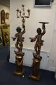TWO 20TH CENTURY PAINTED CARVED WOOD BLACKAMORE FIGURES on a seperate pillar base, maximum
