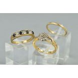 A COLLECTION OF RINGS, to include a 9ct gold diamond cluster ring, cross over design, total