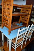 A FORMICA TOPPED FOLDING TABLE, five various chairs and a three tier trolley (7)