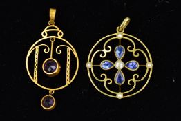 TWO EDWARDIAN GOLD PENDANTS, both of circular outline, the first suspending a central circular