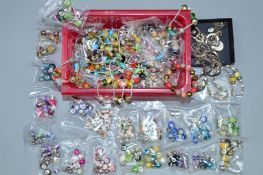 A SELECTION OF CHARMS AND MAINLY SILVER JEWELLERY, the charms of varying designs, mostly glass, some