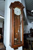 A MODERN KERMLE MAHOGANY WALL CLOCK, approximate height 114cm (two weights, winding key and