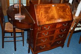 A REPRODUCTION MAHOGANY FALL FRONT BUREAU, a mahogany hall table with two drawers and a half moon