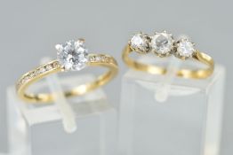 TWO 9CT GOLD CIUBIC ZIRCONIA RINGS, the first designed as a central circular cubic zirconia with