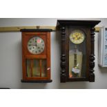 AN OAK VIENNA WALL CLOCK, with circular dial and roman numerals together with another wall clock (