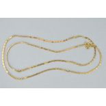 A 9CT GOLD CHAIN NECKLACE, designed as sections of flattened and curb link chain, to the spring