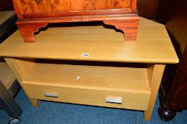 A LIGHT OAK CORNER TV STAND, with a single drawer