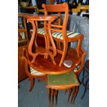 A YEW WOOD CIRCULAR EXTENDING DINING TABLE, and four chairs (5)