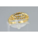 AN EARLY 20TH CENTURY 18CT GOLD FIVE STONE DIAMOND RING, designed as five graduated old and single