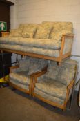 AN ERCOL BLONDE ASH THREE PIECE LOUNGE SUITE, comprising of a two seater settee and a pair of