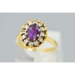 A MID 20TH CENTURY 18CT GOLD AMETHYST AND DIAMOND OVAL CLUSTER RING, oval head measuring