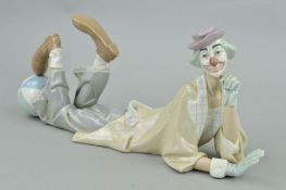 A LLADRO FIGURE OF A CLOWN LYING DOWN, with a ball at his feet, No.4618, length 37cm