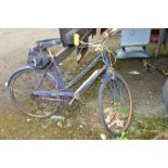 A BLUE VINTAGE RALEIGH BICYCLE