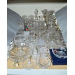 A QUANTITY OF CUT GLASS ITEMS, to include decanters, vases, water jugs, dessert bowls and dressing