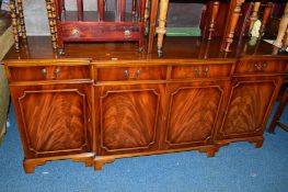 A YEW WOOD BREAKFRONT SIDEBOARD, with four drawers, approximate size width 196cm x depth 53cm x