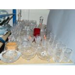 A QUANTITY OF CUT GLASS ETC, to include drinking glasses, fruit bowls, decanters and vases, together