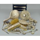 A PARCEL OF SILVER BACKED/HANDLED DRESSING TABLE REQUISITES, including hand mirrors, brushes, button