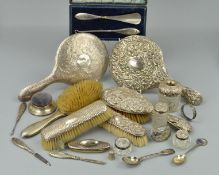 A PARCEL OF SILVER BACKED/HANDLED DRESSING TABLE REQUISITES, including hand mirrors, brushes, button