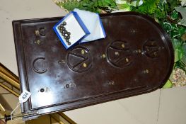 A BAKELITE BAGATELLE BOARD, some wear to lettering, with a quantity of ball bearings