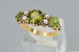 A LATE 20TH CENTURY PERIDOT AND SEED PEARL HALF HOOP RING, fancy scroll design sides and