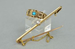 A LATE VICTORIAN 9CT GOLD RING AND AN EARLY 20TH CENTURY 15CT GOLD BROOCH, the ring with a central