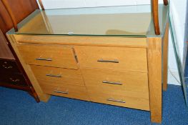 A LIGHT OAK SIDEBOARD, with glass top and six drawers, approximate size width 120cm x depth 45cm x
