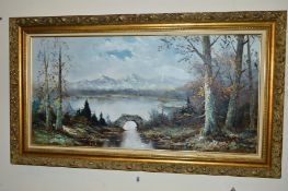 AN OIL ON CANVAS PAINTING OF A VIEW ACROSS A LAKE TO DISTANT MOUNTAIN VIEWS, indistinctly signed