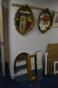 TWO SIMILAR FOLIATE GILT FRAMED WALL MIRRORS, oak oval wall mirror and three other wall mirrors (6)