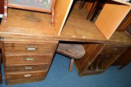 AN OAK DESK, with five drawers, approximate size width 159cm x depth 77cm x height 76cm