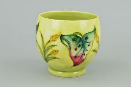 A SMALL MOORCROFT POTTERY FOOTED JARDINIERE, 'Arum Lily' pattern on yellow ground, impressed and