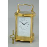 A MAPPIN AND WEBB BRASS CASED CARRIAGE CLOCK OF SERPENTINE FORM, enamel dial with Roman numerals,
