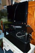 A 32' LCD TV, LG DVD player and a glass three tier TV stand (3)