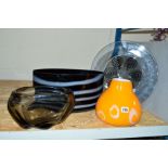 FOUR PIECES OF DECORATIVE GLASS VASES AND A CHARGER, to include an orange example with white