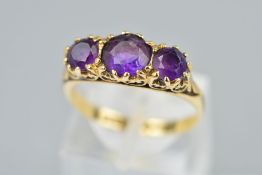 A LATE 20TH CENTURY 9CT GOLD AMETHYST HALF HOOP RING, fancy scroll detail to the sides and