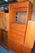 A TEAK TWO DOOR CABINET, two oak pot cupboards, a Stag teak chest of four long graduated drawers,