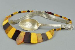 THREE ITEMS, to include an amber necklace, designed as graduated modified and natural amber panels