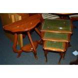 A YEW WOOD HALF MOON TABLE, a nest of three tables and a magazine rack (3)