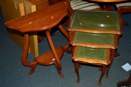 A YEW WOOD HALF MOON TABLE, a nest of three tables and a magazine rack (3)